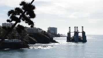 Maritime platform stranded on the coast of a beach a sunny day video