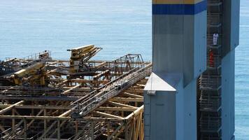 Bemalmadena, Spain, 2017 - Part of a maritime platform structure with operators on a sunny day video