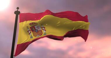 Spain flag waving at wind at sunset in slow, loop video