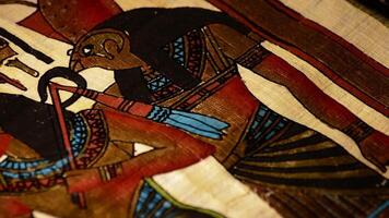 Egyptian papyrus with pharaohs and hieroglyphics representation of turning video