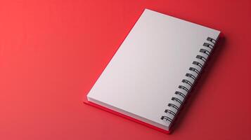a blank notebook mockup on a red background with copy space photo