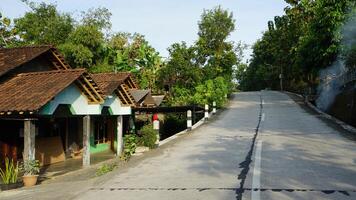 a road with a house on it and a sign that says house photo