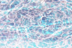 Bluewater waves on the surface ripples blurred. Defocus blurred transparent blue colored clear calm water surface texture with splash and bubbles. Water waves with shining pattern texture background. photo