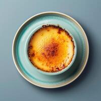 Close-up of a delicious creme brulee dessert with a crispy caramelized sugar topping. Creamy and sweet treat perfect for a romantic dinner or special occasion. photo