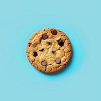 Homemade chocolate chip cookie with sea salt on a blue background photo