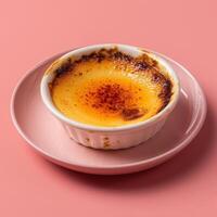 Close-up of a delicious creme brulee dessert with a crispy caramelized sugar topping. Creamy and sweet treat perfect for a romantic dinner or special occasion. photo