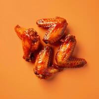 Chicken Wings on Orange Background photo