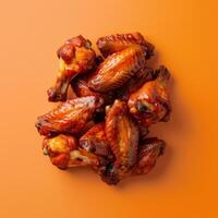 Chicken Wings on Orange Background photo