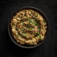 A Bowl of Creamy Baba Ganoush, Traditional Middle Eastern Dip photo