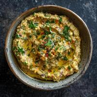 Close-up of Baba Ganoush with Olive Oil and Herbs photo