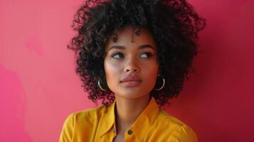 Radiant Woman in Yellow Jumpsuit Posing Against Magenta Background - Close-Up Half Body Portrait with Copy Space for Text photo
