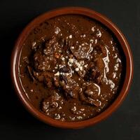 Spicy Beef and Bean Stew in a Clay Bowl photo
