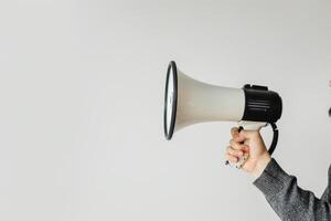 Hand holding a megaphone with a blank space for text photo