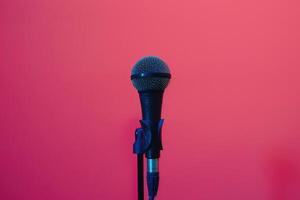 Microphone on stage with pink background photo