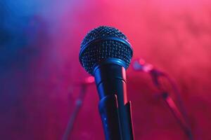 Close up of a microphone on stage with a colorful background photo
