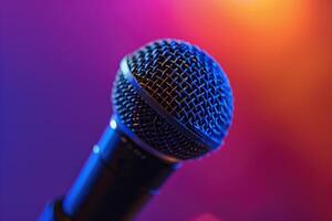 Close up of a microphone on stage with colorful blurred background lights photo