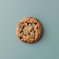 Close-up of a delicious chocolate chip cookie on a blue background. Perfect for food blogs, dessert menus, or bakery websites. photo