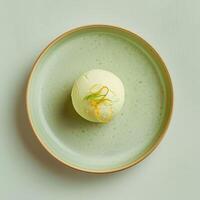 Gourmet Lemon Sorbet Ice Cream Dessert on Green Plate photo