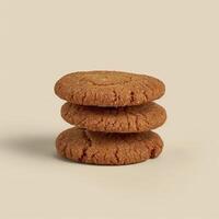 Stack of homemade ginger cookies with a light dusting of sugar on top, isolated on a beige background. Food photography for recipe, bakery, and cookie packaging. photo