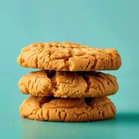 Close up of a stack of three homemade peanut butter cookies. Delicious sweet treat with soft and chewy texture. Concept of baking and snacking. photo