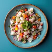 Close up of fresh ceviche, a popular Peruvian dish, with fish, red onions, cilantro, and lime juice. Traditional South American food on a blue plate. photo