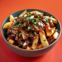 Delicious poutine with gravy, cheese curds, and fries, a Canadian classic. photo