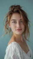 Serene Half Body Portrait of Beautiful Woman With Soft Smile in Natural Light Against Powder Blue Background photo