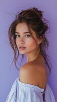 Serene Woman with Gentle Smile on Pastel Purple Background in Natural Light photo
