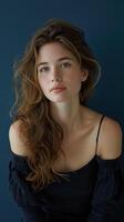Serene Half-Body Portrait of Beautiful Woman Contemplating Against Navy Blue Background with Natural Light photo