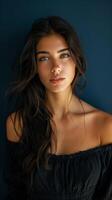 Serene Portrait of a Thoughtful Woman on Navy Blue Background with Soft Natural Light photo