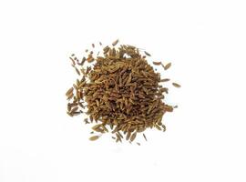 Pile of cumin seeds isolated on white background photo