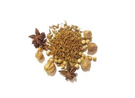 Pile of spices and herbs, there are cumin, cardamom, pepper, and star anise isolated on white photo
