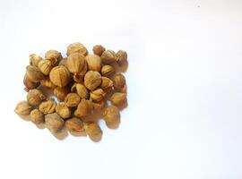 Dried cardamom, as a complementary spice in cooking seasonings, flat lay shot and isolated on white background. photo