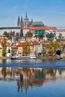 View of Charles bridge over Vltava river and Gradchany photo