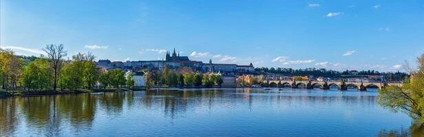 View of Charles bridge over Vltava river and Gradchany photo