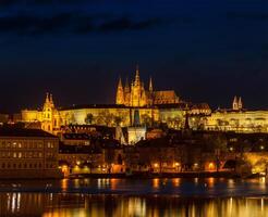 View of Charles Bridge and Prague Castle in twilight photo