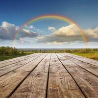 Wooden terrace with rianbow sky background photo