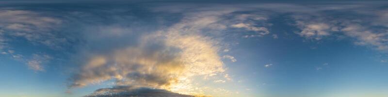 Dark blue sunset sky panorama with Cumulus clouds. Seamless hdr pano in spherical equirectangular format. Complete zenith for 3D visualization, game and sky replacement for aerial drone 360 panoramas. photo