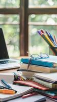 Office desk table with laptop, books, pencils and coffee cup. photo