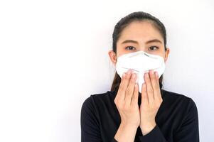 Portrait of young Asian woman wearing N95 mask for protect smog PM2.5 bad air pollution. photo