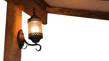 Cut out image of an antique lamp covered in dust and cobwebs with clipping paths on white background. photo