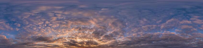 Golden sunset sky panorama Seamless spherical equirectangular 360-degree view with beautiful Stratocumulus clouds setting sun - for use in 3D graphics as a sky dome or post-processing of drone images photo