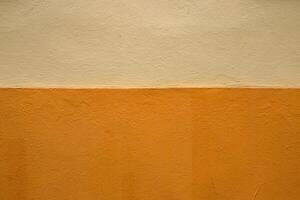 Vibrant orange wall texture with a subtle beige stripe, perfect for background, design inspiration or artistic project. Image of imperfections and unique details of an outdoor painted surface. photo