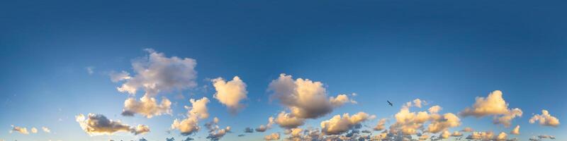Dark blue sunset sky panorama with Cumulus clouds. Seamless hdr pano in spherical equirectangular format. Complete zenith for 3D visualization, game and sky replacement for aerial drone 360 panoramas. photo