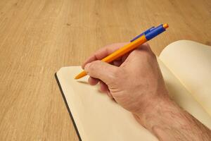 taking notes on a notebook photo