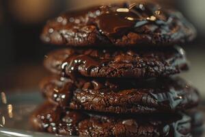 Stack of chocolate chip cookies covered in melting chocolate photo