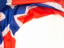 Top view of the Norway flag on a wooden table with space for text. Close-up photo