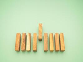 Top view of empty wooden blocks isolated on a green background. Concept of planning, strategy, and risk and in business. Space for text photo