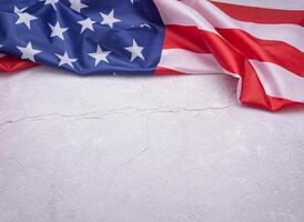Part of the American flag isolated on a gray stone background. Top view. Flat lay. Space for text photo