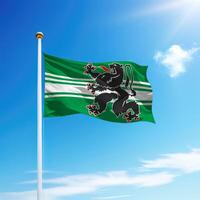 Waving flag of East Flanders is a province of Belgium on flagpole photo